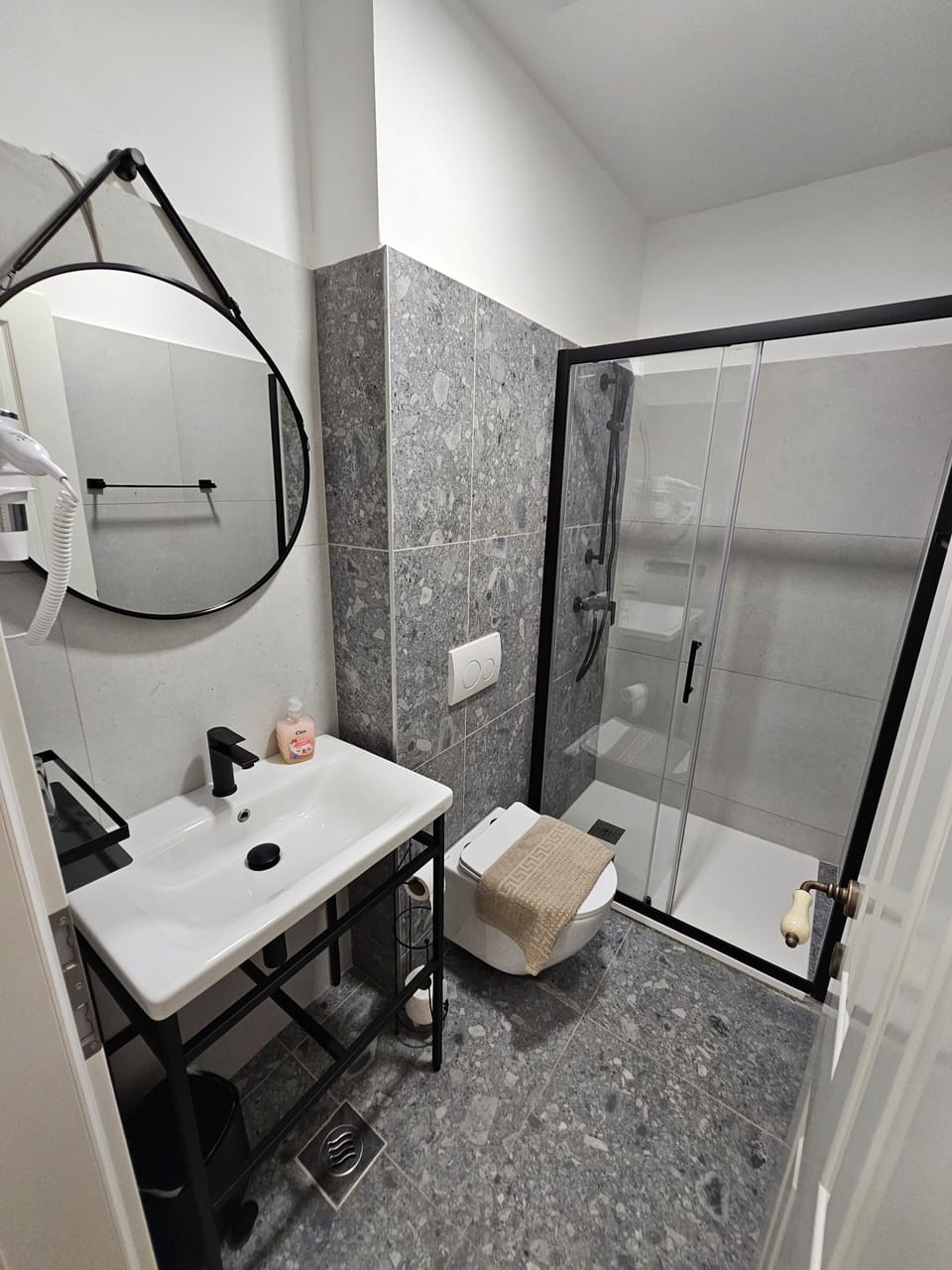 Combined shower/tub, hair dryer, towels, toilet paper