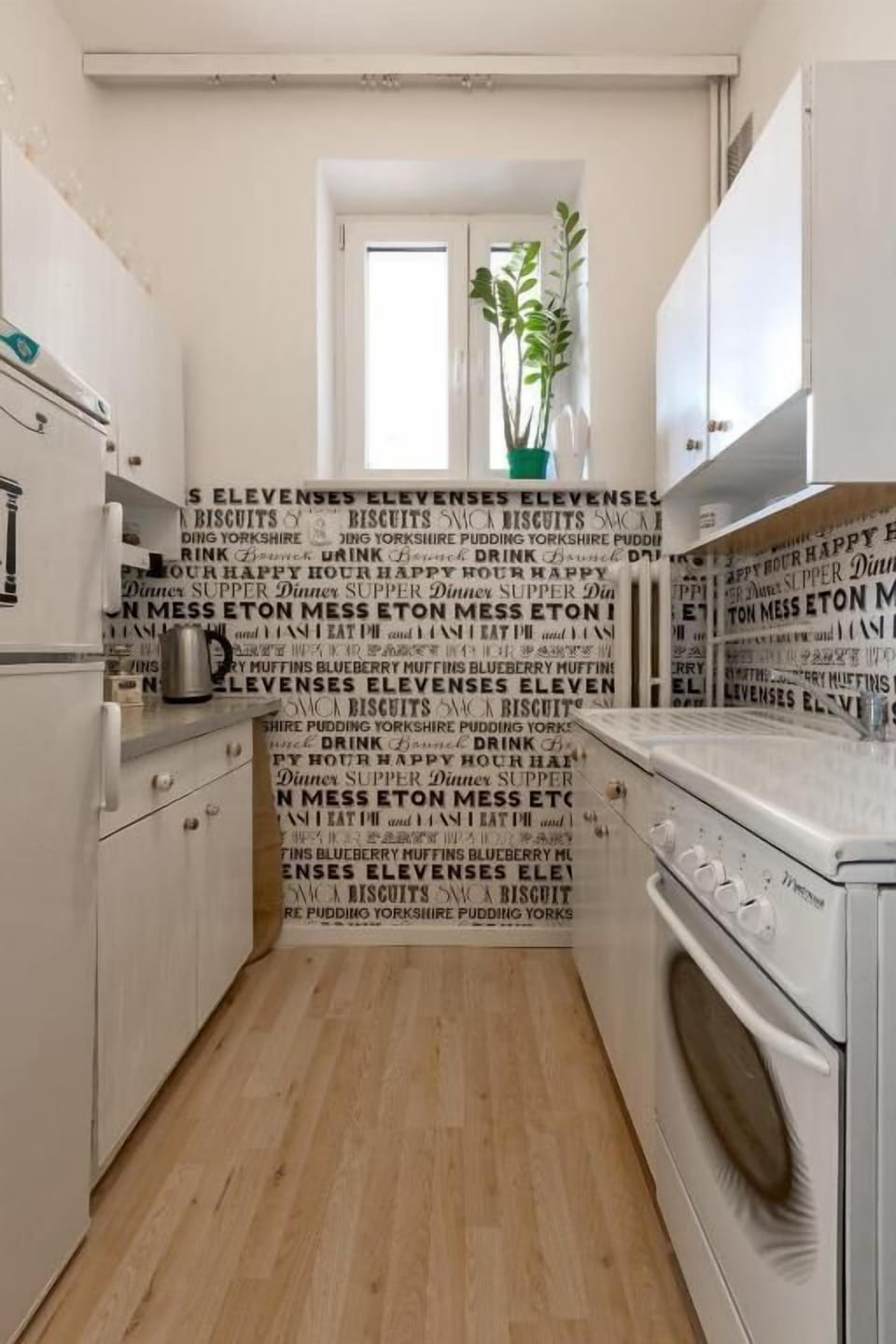 Full-size fridge, stovetop, cookware/dishes/utensils