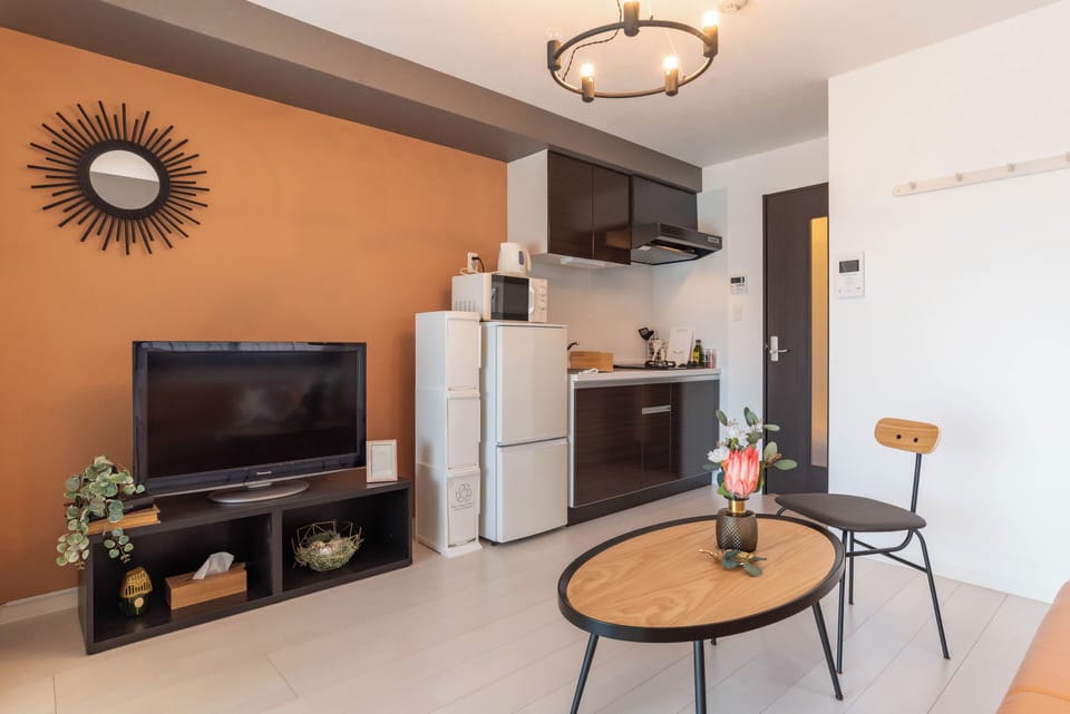 Comfort Apartment | Living area | 32-inch flat-screen TV with digital channels