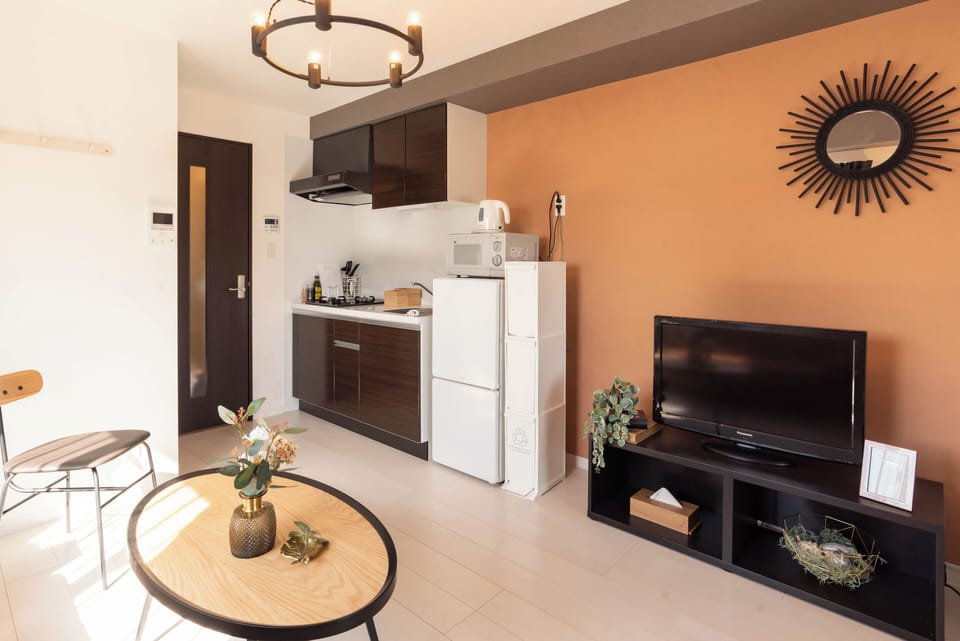 Comfort Apartment | Living area | 32-inch flat-screen TV with digital channels