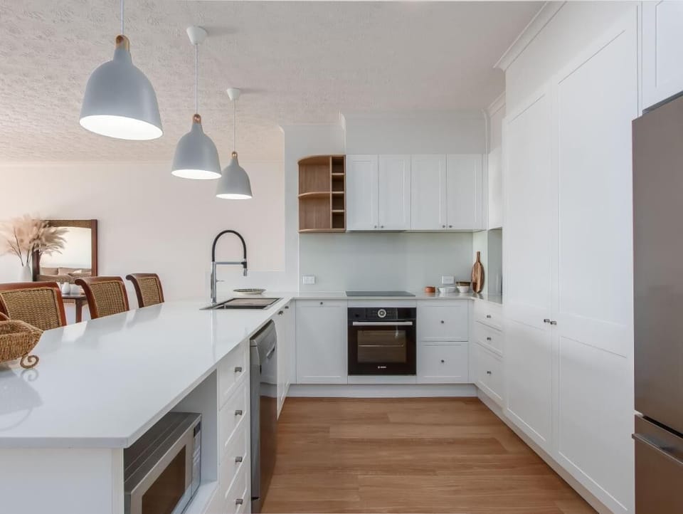 Apartment, Balcony, Beach View | Private kitchen | Electric kettle, dining table