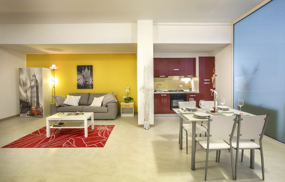 Grand Loft, 1 Queen Bed with Sofa bed, Kitchen, Poolside | Living area | 28-inch flat-screen TV with digital channels, TV
