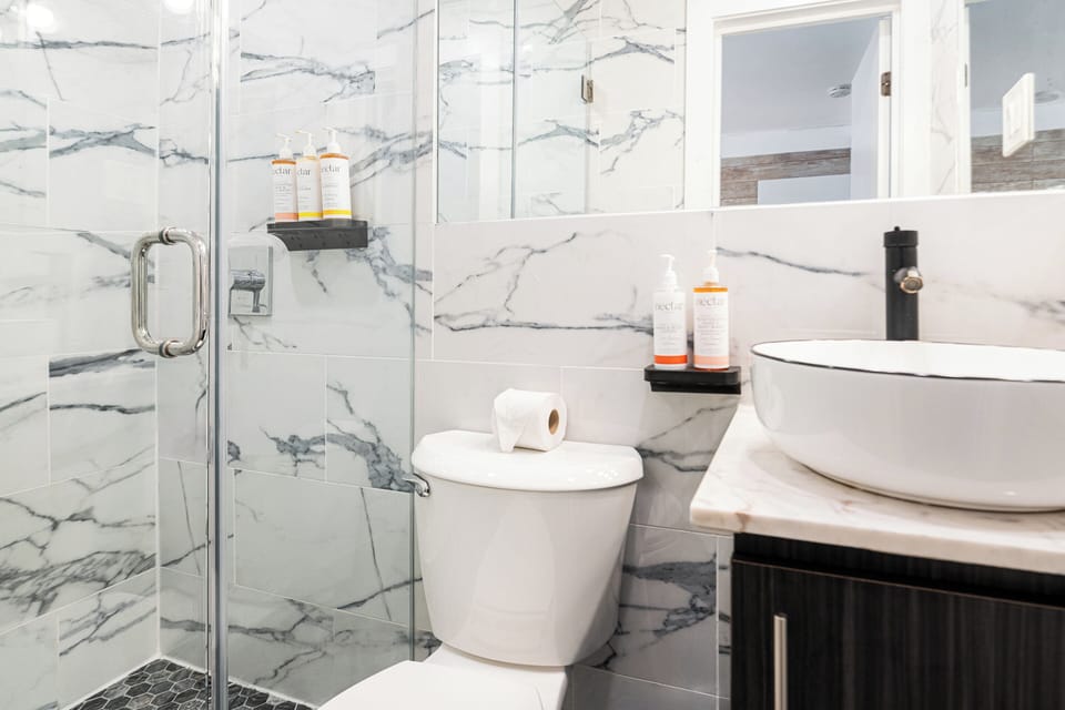Double Queen Family Room | Bathroom | Shower, designer toiletries, hair dryer, towels
