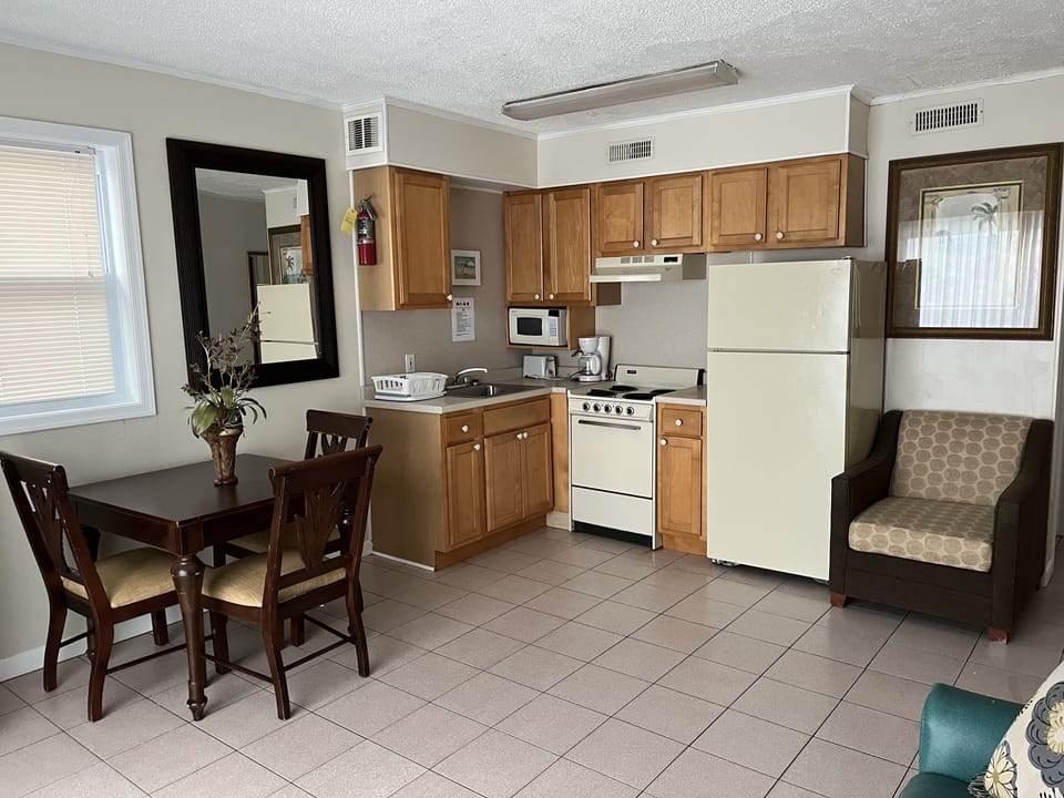 Deluxe Condo, 1 Bedroom, Kitchen, City View | Living area | Flat-screen TV
