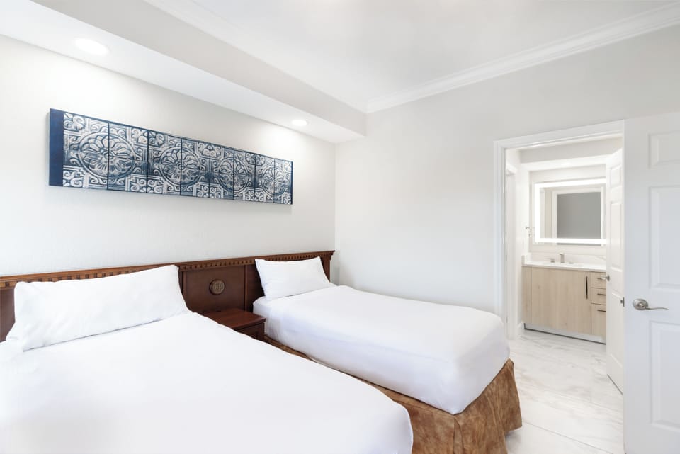 Signature Suite, 2 Bedrooms | 2 bedrooms, down comforters, in-room safe, laptop workspace