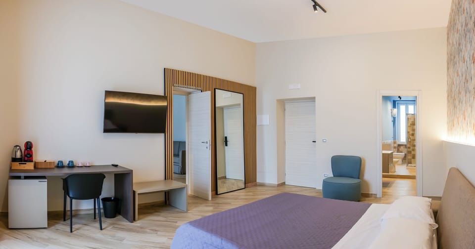 Family Suite, Balcony, City View | Select Comfort beds, minibar (free items), in-room safe, desk