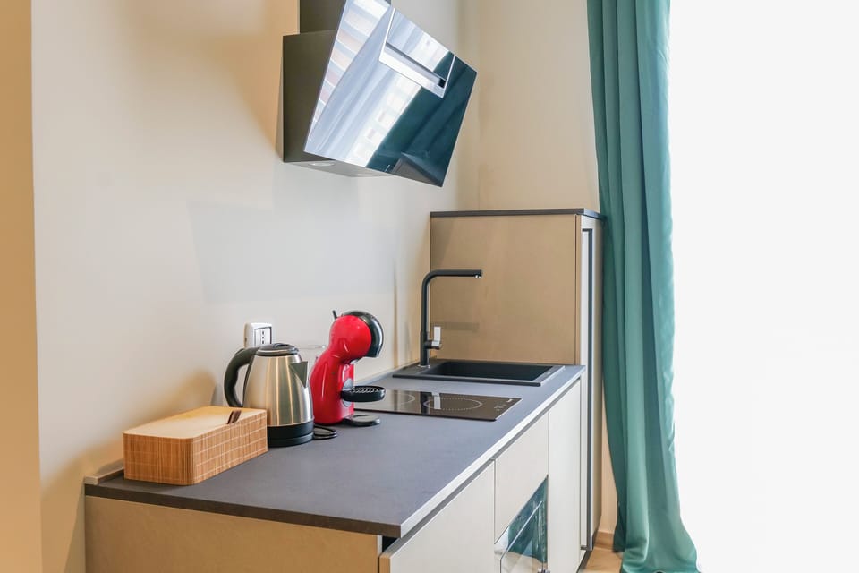 Family Suite, Balcony, City View | Private kitchen | Espresso maker, coffee/tea maker, electric kettle, coffee grinder