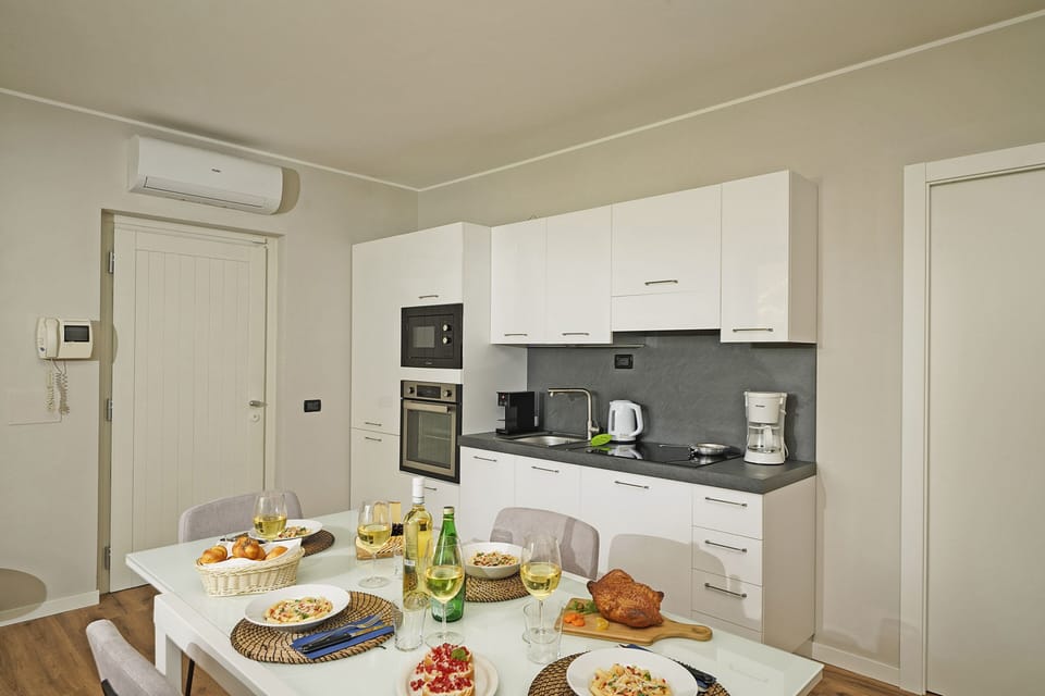 Apartment, Garden View | Private kitchen | Fridge, microwave, oven, stovetop