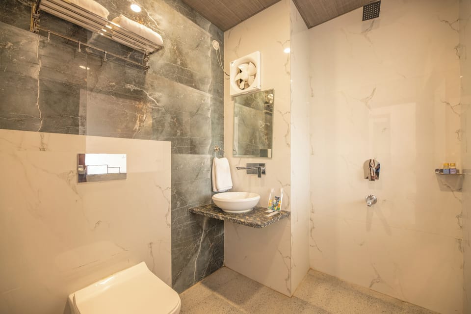 Deluxe Double Room, City View | Bathroom | Shower, hair dryer, slippers, towels