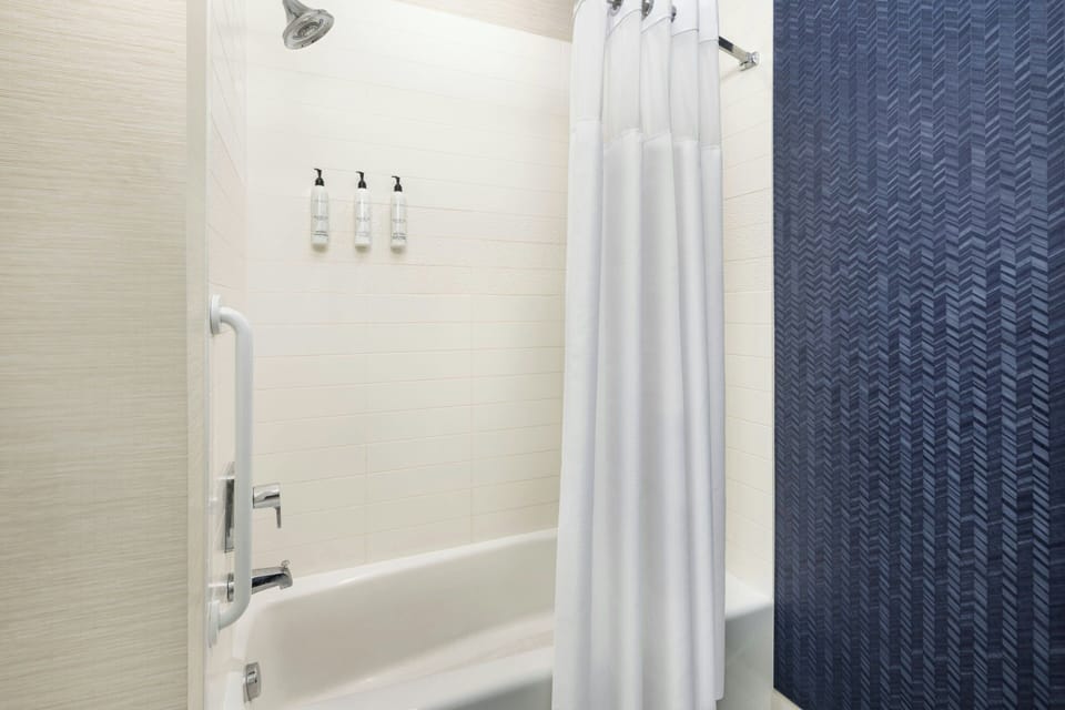 Room, 2 Queen Beds | Bathroom | Combined shower/tub, designer toiletries, hair dryer, towels