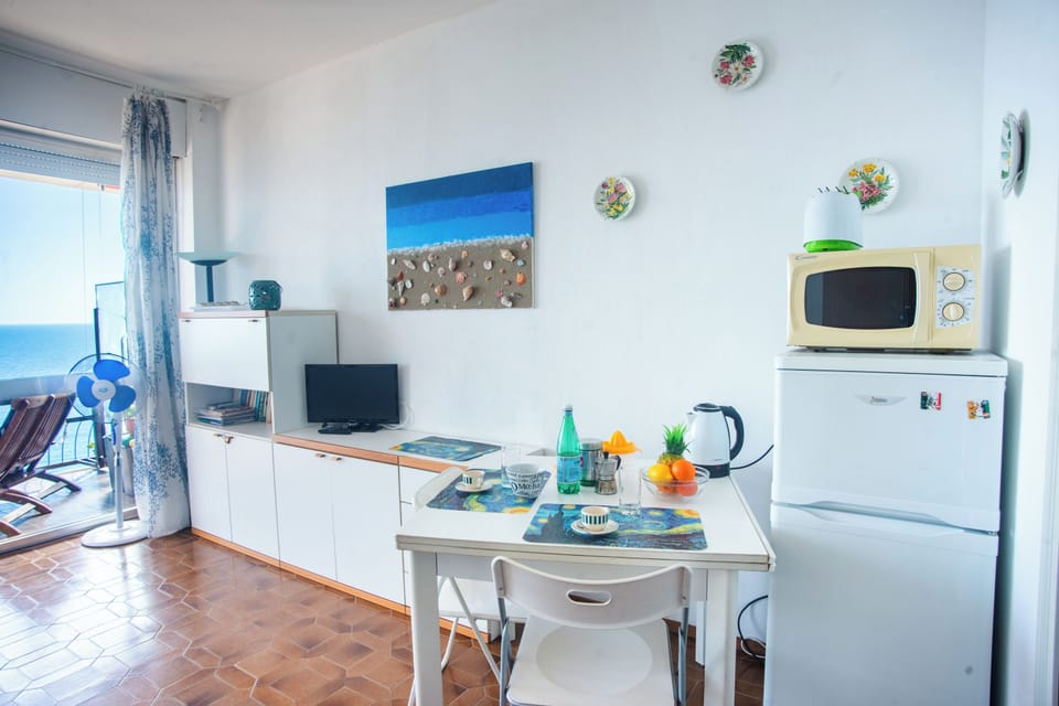 Family Apartment, Multiple Bedrooms (Sole Surf E Relax) | Private kitchen | Fridge, microwave, oven, stovetop