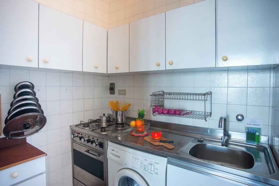 Family Apartment, Multiple Bedrooms (Sole Surf E Relax) | Private kitchen | Fridge, microwave, oven, stovetop