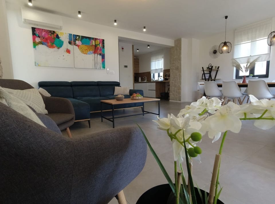 Villa (Four Bedroom Villa) | Living room | 32-inch flat-screen TV with satellite channels