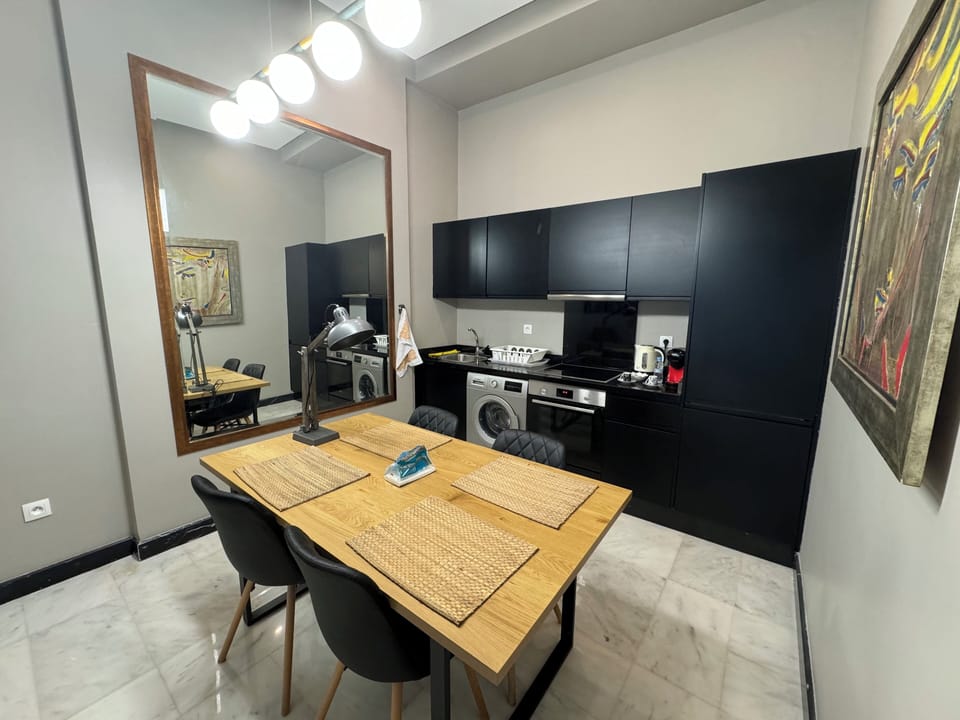 Luxury Apartment | Private kitchen | Espresso maker, coffee/tea maker, electric kettle, dining tables