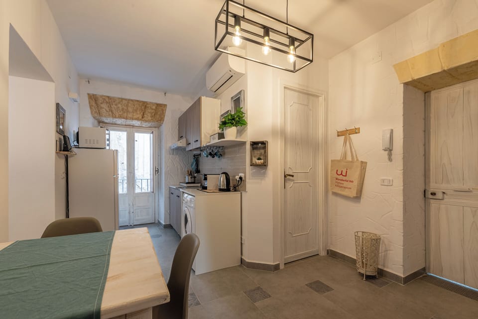 Apartment | Living area | 32-inch flat-screen TV with cable channels