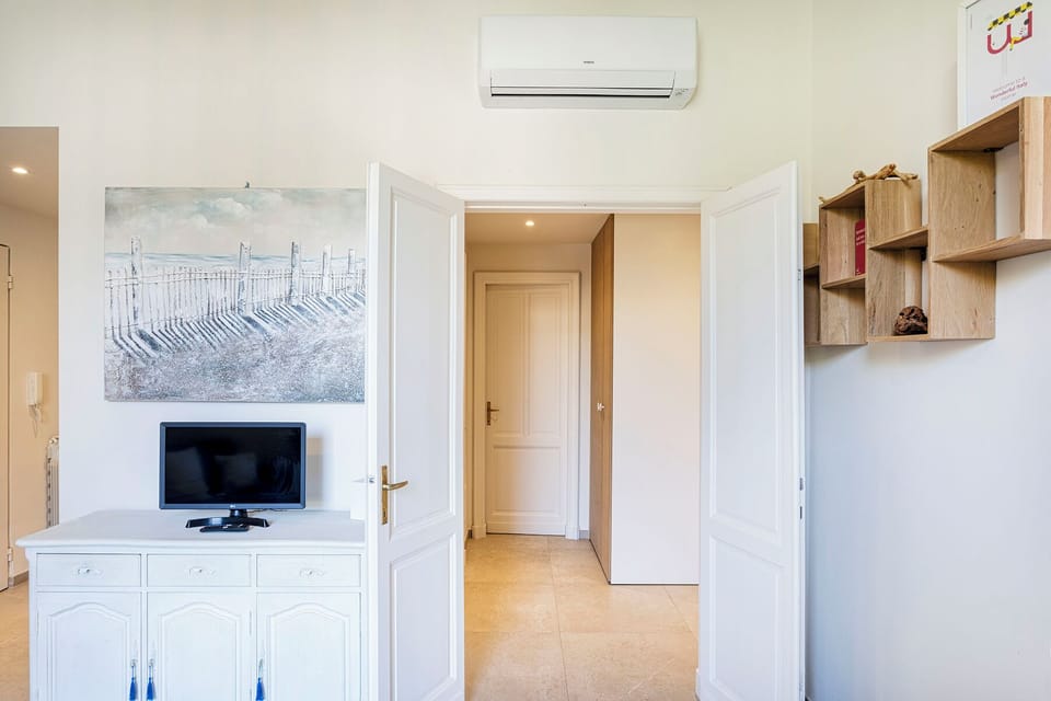 Apartment, Courtyard View | Television