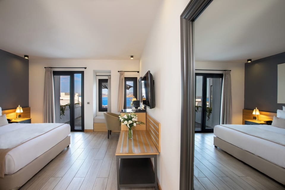 Deluxe Double Room, Terrace, Sea View | Premium bedding, minibar, in-room safe, desk