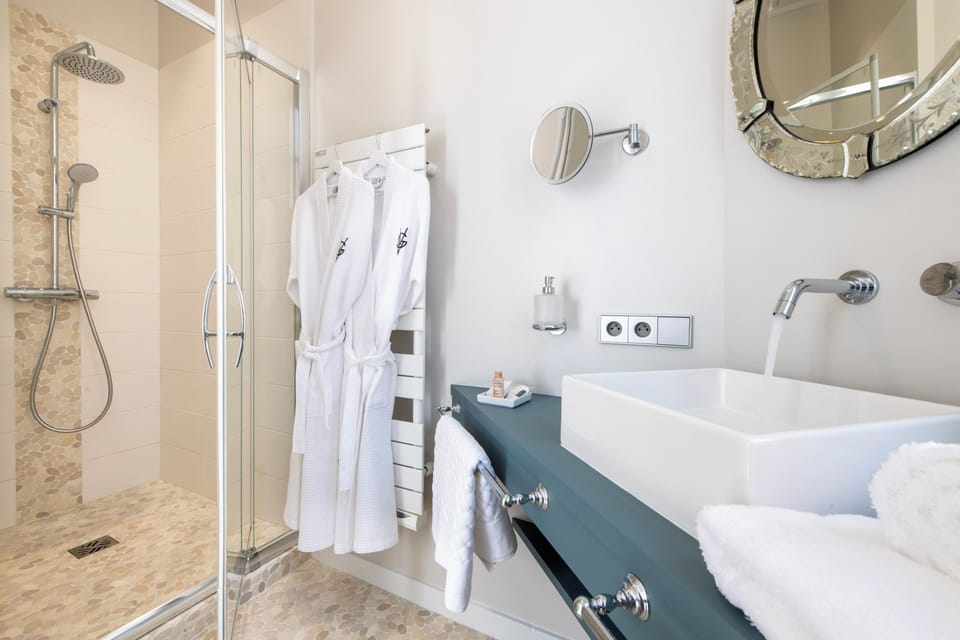Hair dryer, bathrobes, slippers, towels