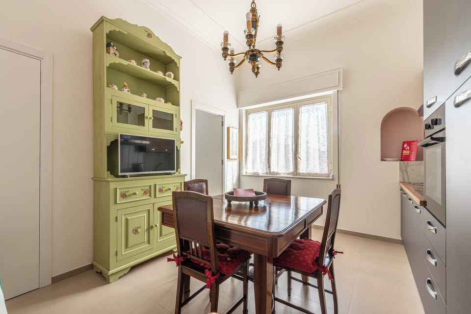 Apartment, Balcony, City View | Living area | 32-inch TV with digital channels