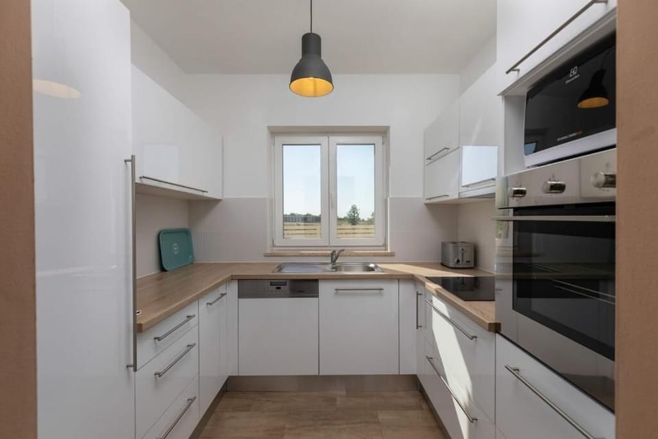 Villa, 4 Bedrooms | Private kitchen | Full-size fridge, microwave, oven, stovetop