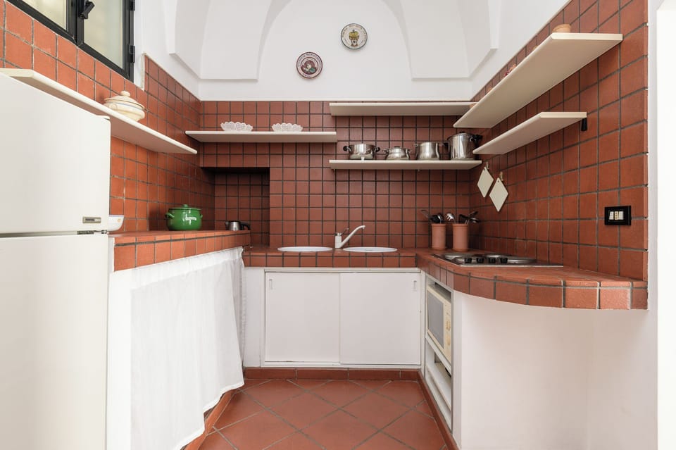 Apartment | Private kitchen | Fridge, stovetop, cookware/dishes/utensils, dining tables