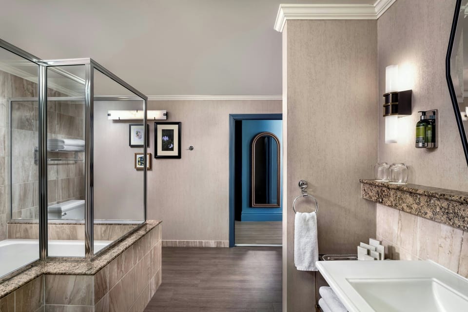 Combined shower/tub, designer toiletries, hair dryer, towels