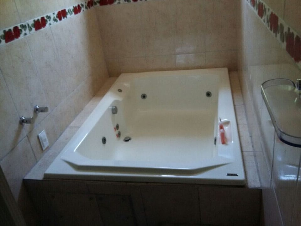 Deluxe Room | Bathroom | Hair dryer, soap, shampoo, toilet paper