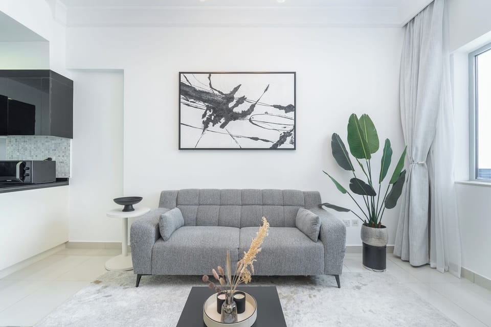 Classic Apartment, Balcony, City View | Living area | 50-inch Smart TV with cable channels