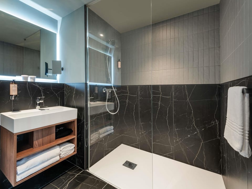 In-room safe, laptop workspace, blackout drapes, soundproofing