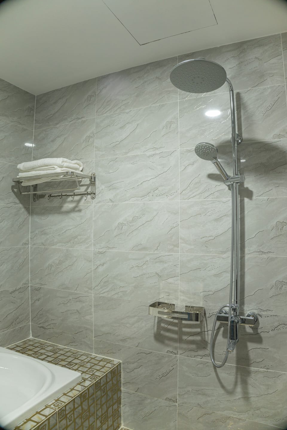 Shower, rainfall showerhead, slippers, towels