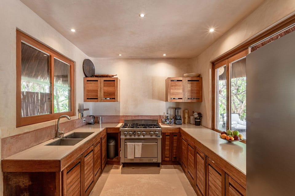 Villa, 4 Bedrooms, Beachfront | Private kitchen | Coffee/tea maker, dining table