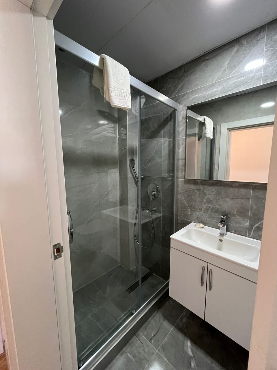 Shower, rainfall showerhead, hair dryer, slippers