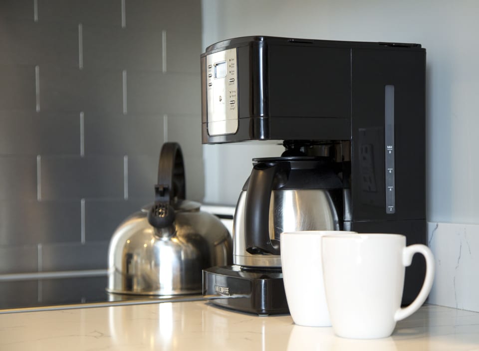 Full-size fridge, microwave, stovetop, coffee/tea maker