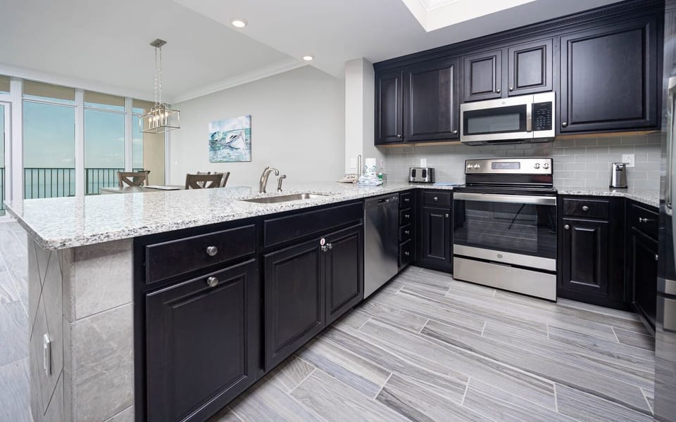 Condo, 2 Bedrooms | Private kitchen | Fridge, oven, coffee/tea maker