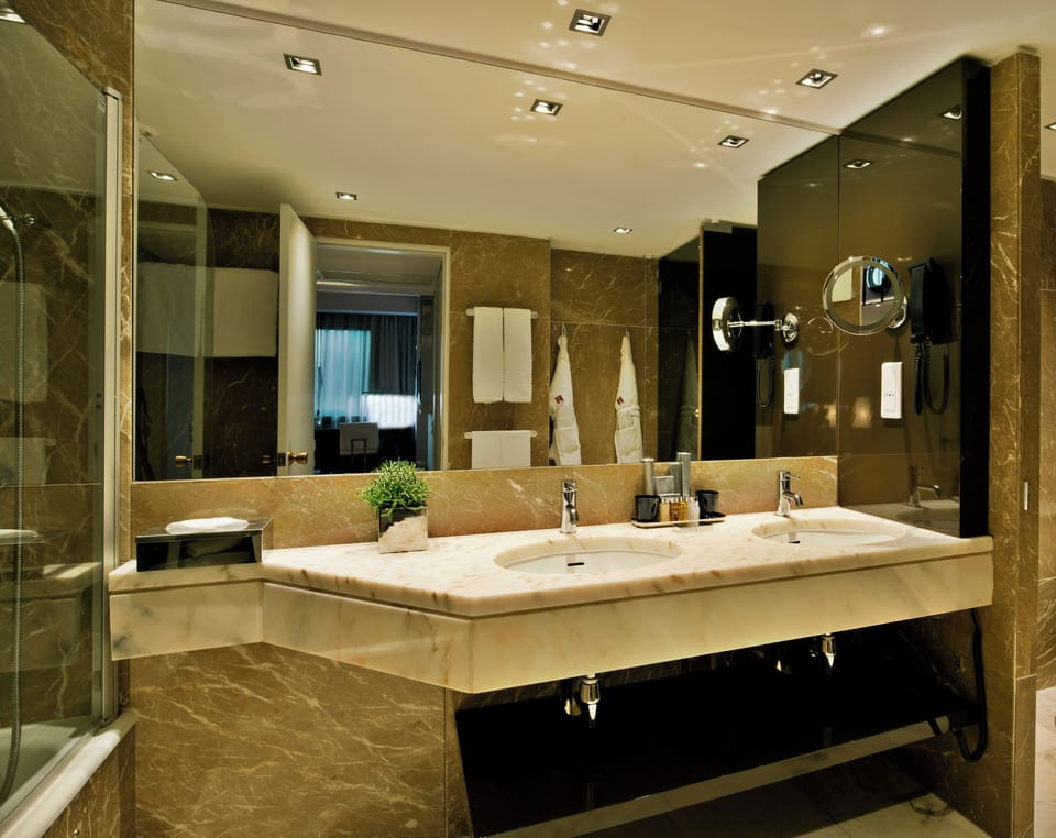 Suite | Bathroom | Designer toiletries, hair dryer, slippers, bidet