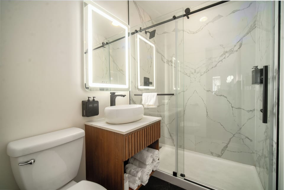 Shower, hair dryer, towels, soap