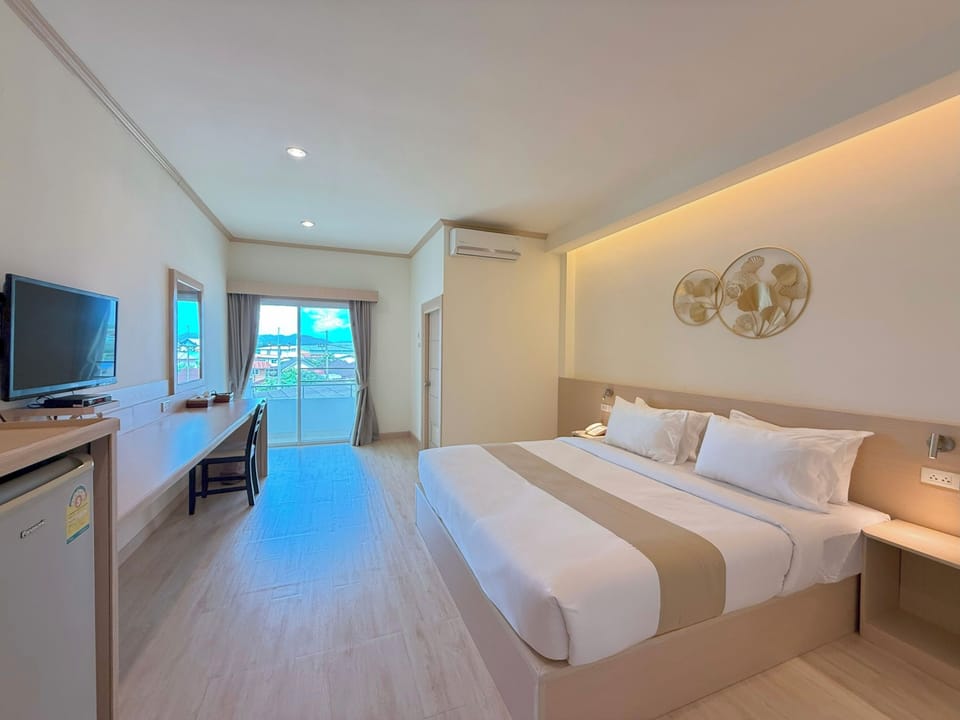 Deluxe Double Room, City View | Individually decorated, desk, laptop workspace, blackout drapes