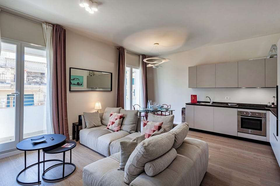 Apartment, Balcony, City View | Living area | 35-inch TV with digital channels