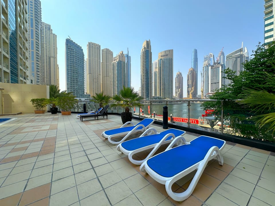 Outdoor pool, open 10:00 AM to 6:00 PM, pool umbrellas, sun loungers