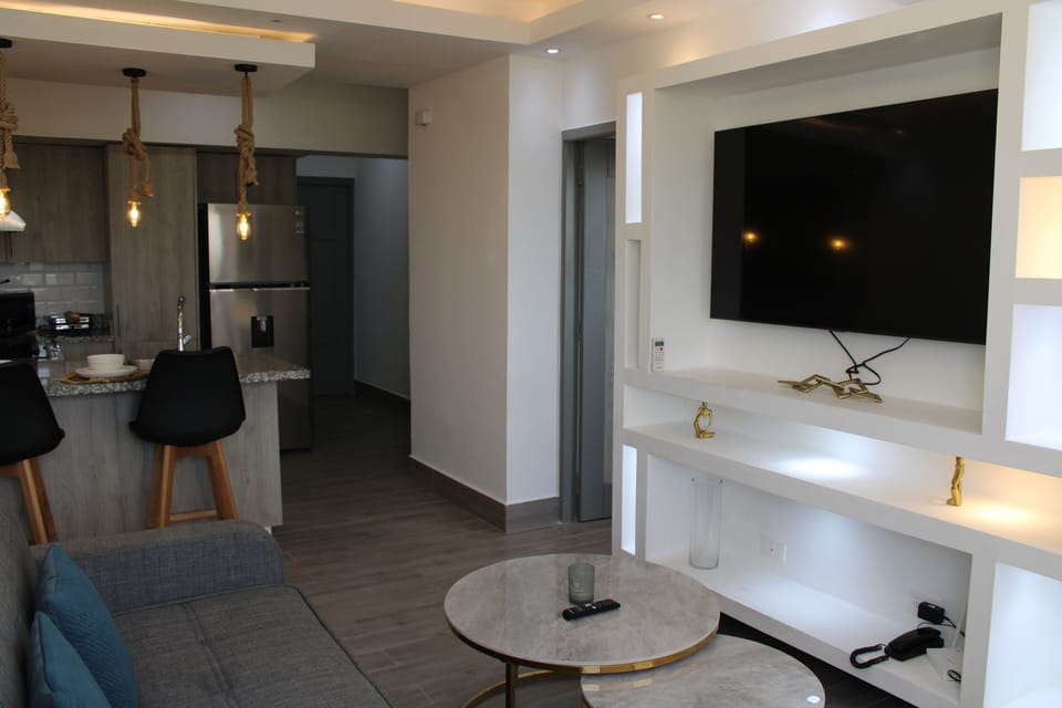 Deluxe Apartment | Living area | Flat-screen TV