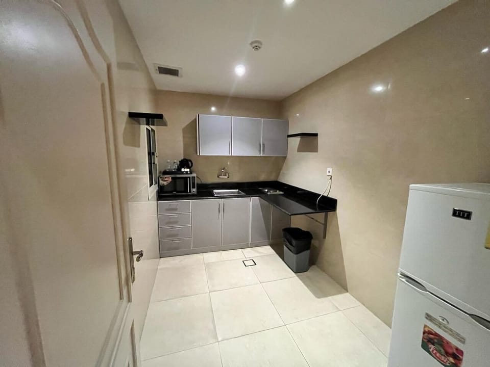 Fridge, microwave, electric kettle, paper towels