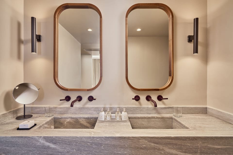 Shower, designer toiletries, hair dryer, bathrobes