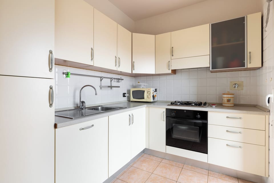 Apartment, Balcony | Private kitchen | Fridge, microwave, stovetop, coffee/tea maker