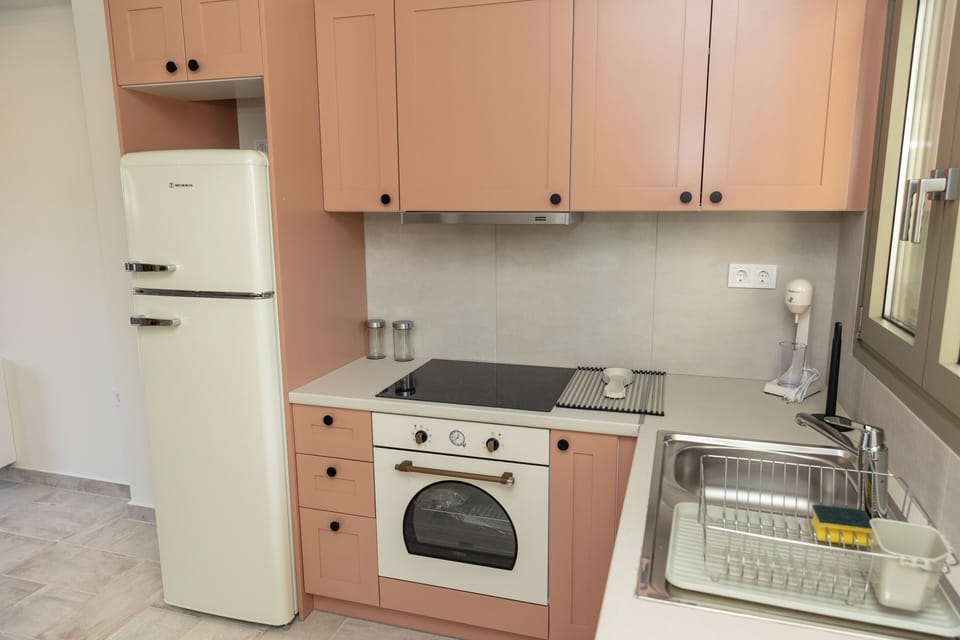 Athena, 2 Bedrooms, Limited Sea View | Private kitchen | Full-size fridge, oven, toaster oven, cleaning supplies