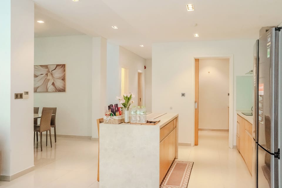Electric kettle, paper towels, dining table