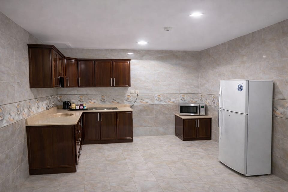 Two-Bedroom Deluxe Apartment | Private kitchen | Mini-fridge, microwave, stovetop, coffee/tea maker