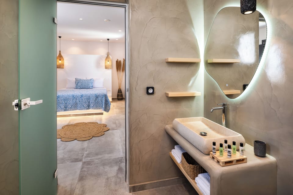Aeolos Suite with Private Hot Tub | Bathroom | Shower, hair dryer, towels, soap