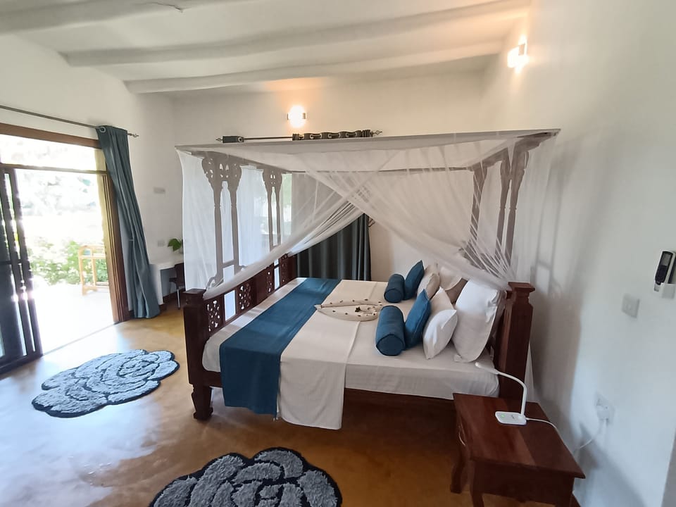 Deluxe Double Room, Balcony, Garden View | In-room safe, desk, laptop workspace, iron/ironing board (on request)