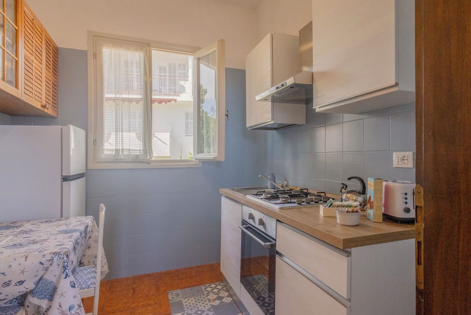 Apartment, Balcony, Sea View | Private kitchen | Electric kettle, highchair