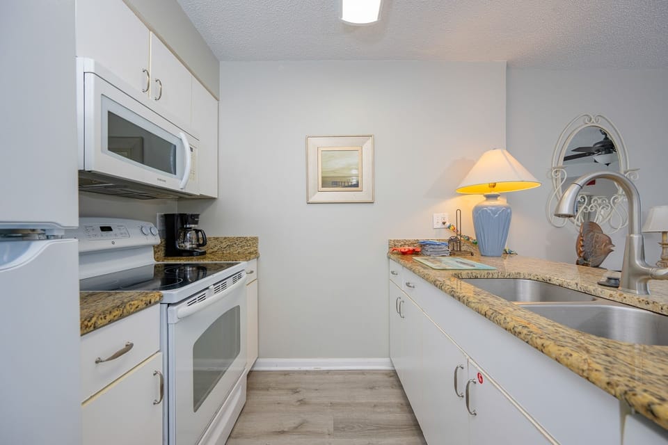 Condo, 2 Bedrooms | Private kitchen | Fridge, oven, coffee/tea maker